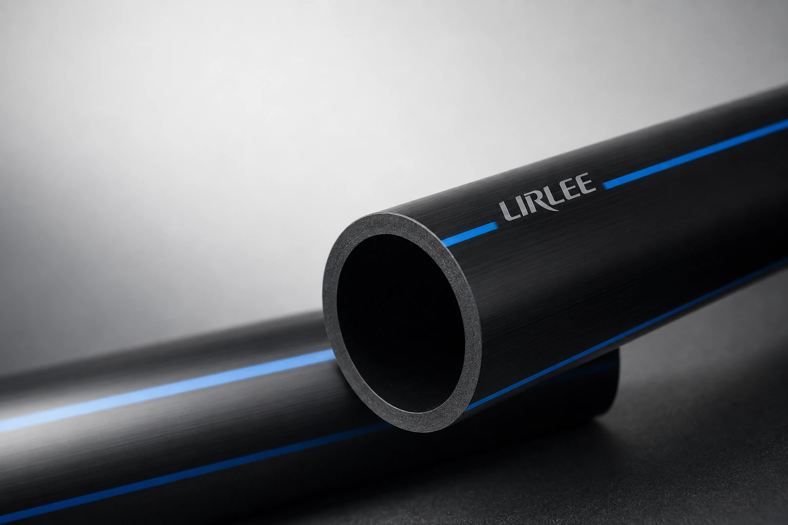 Close-up of black HDPE pipe and guide line